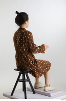    Aera  1 brown dots dress casual dressed sitting white oxford shoes whole body 0012.jpg